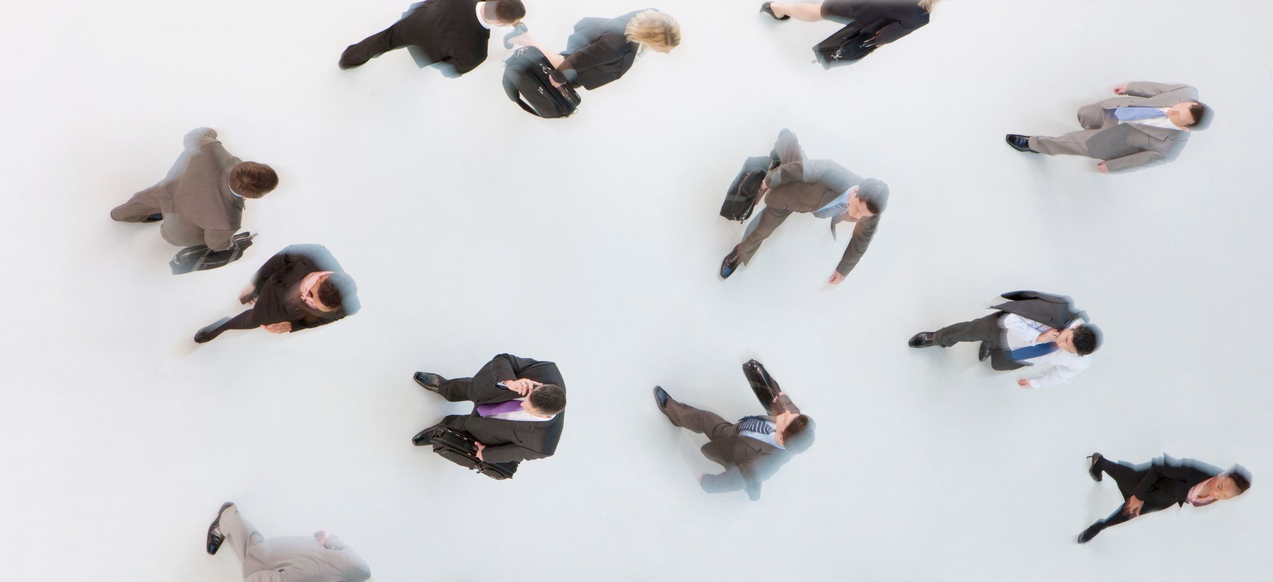 A top angle view of business people walking, accuracy, stability, and reproducibility, useful approximations of crowd dynamics, overcounting and undercounting